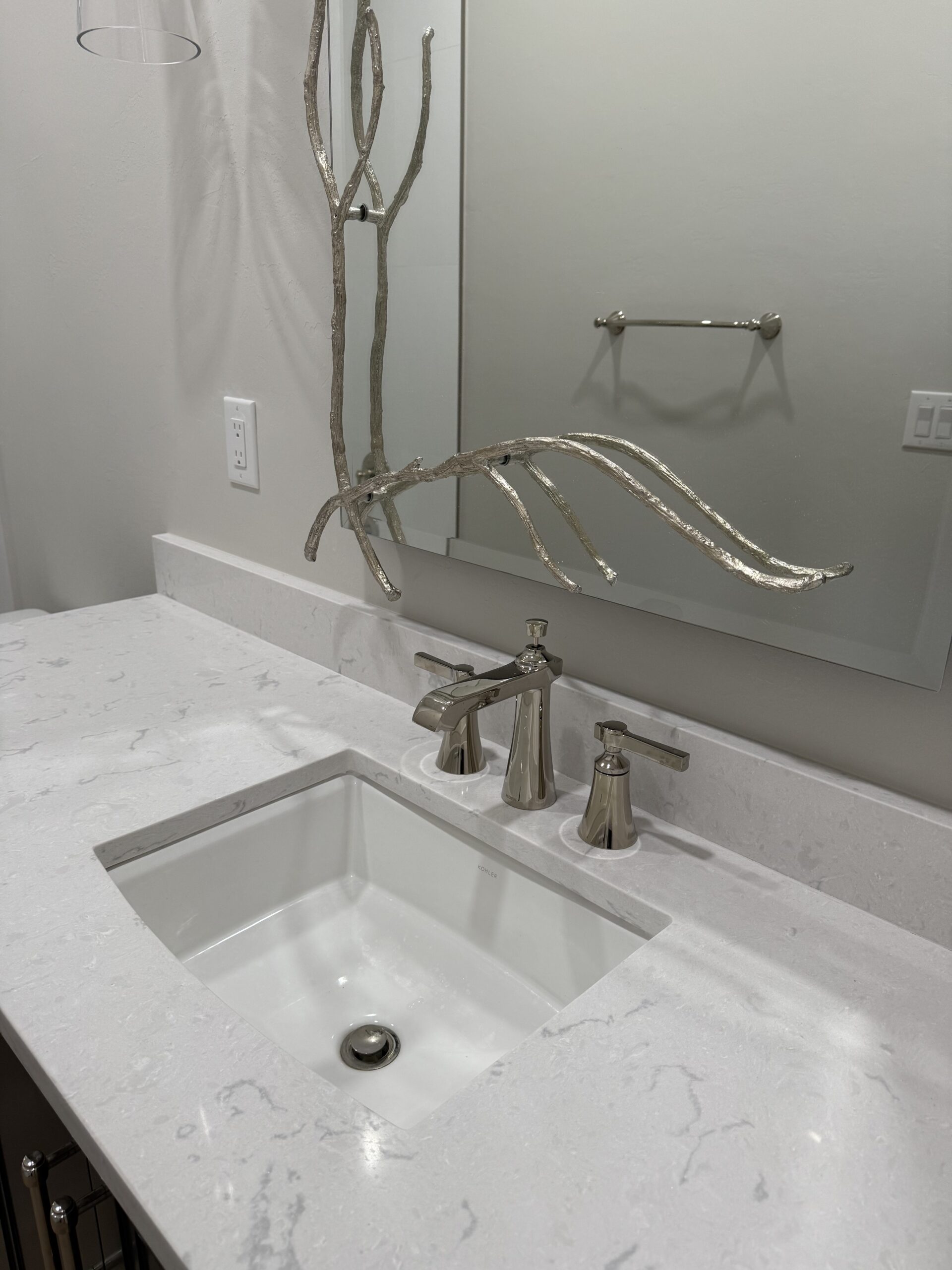 Finished fixture install - Kohler faucet on a quartz vanity